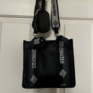 Brand new without tags. Never used. Crossbody bag with coin attachment